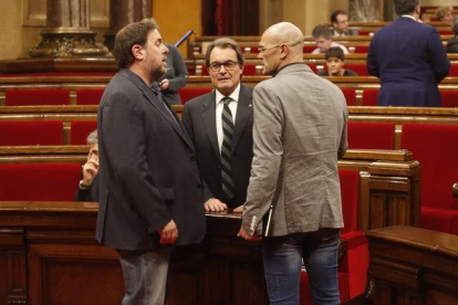 Oriol Junqueras, Artur Mas y Raül Romeva, en el Parlament.