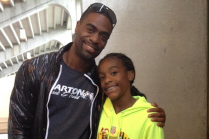 El atleta Tyson Gay y su hija, Trinity.