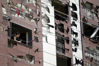 Edificio dañado por la explosión de un coche bomba en un barrio al sur de Damasco, Síria.