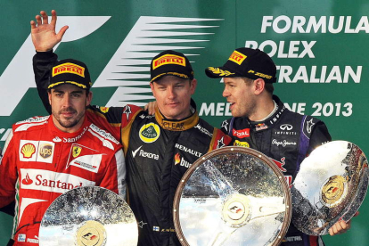 Raikkonen, en el podio, junto a Alonso, segundo, y Vettel, tercero.