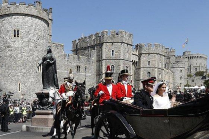 Meghan y Enrique dejan en carroza el castillo de Windsor tras su boda, en mayo del 2018.
