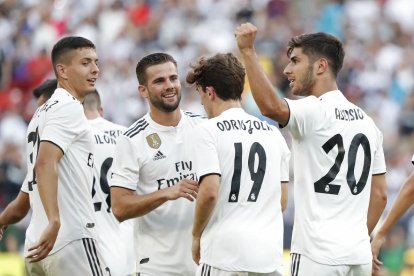 Asensio celebra un gol junto a sus compañeros en el Real Madrid-Juventus