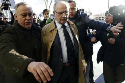 Rato llega a los juzgados de plaza de Catilla en febrero pasado.