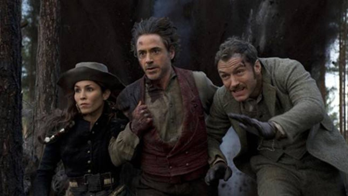 Noomi Rapace, Robert Downey Jr. y Jude Law, en 'Sherlock Holmes: juego de sombras'.