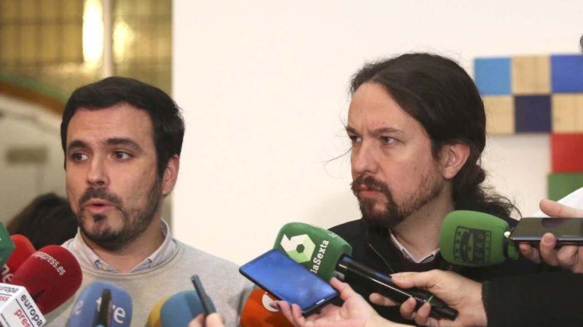 Alberto Garzón y Pablo Iglesias, en una reunión el pasado mes de diciembre.