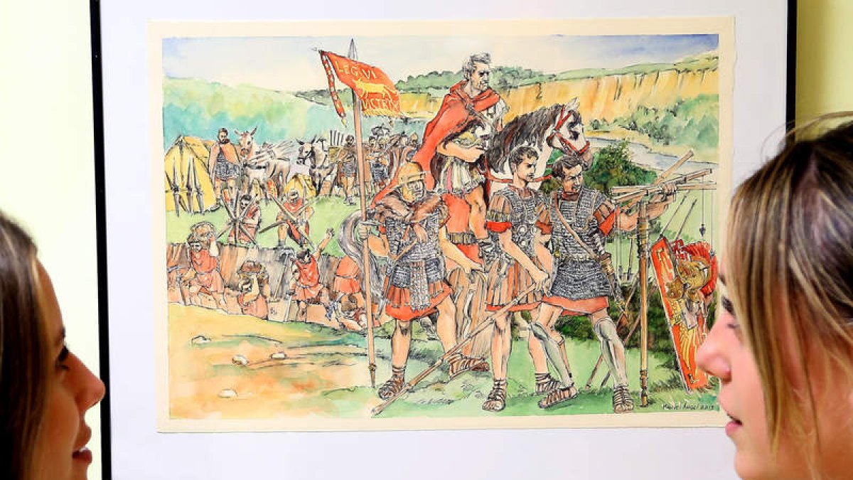 Dos jóvenes visitantes observan una ilustración sobre un grupo de legionarios de la Legio VI Victrix.