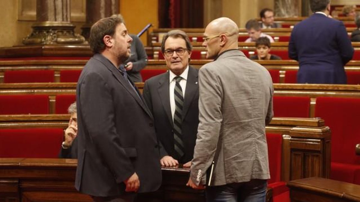 Oriol Junqueras, Artur Mas y Raül Romeva, en el Parlament.
