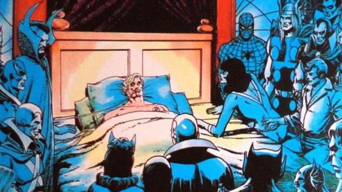 Mar-Vell (el Capitán Marvel) agoniza en la cama rodeado de superhéroes.