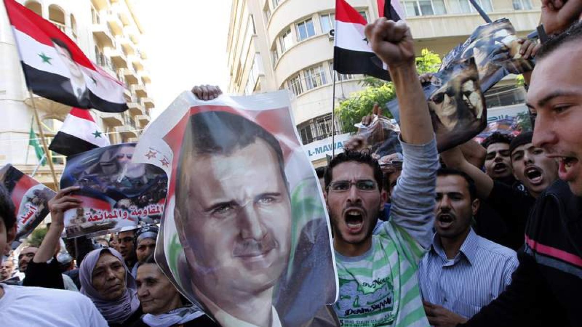 Manifestación en apoyo a Al Assad y en rechazo a la resolución de la Liga Árabe.