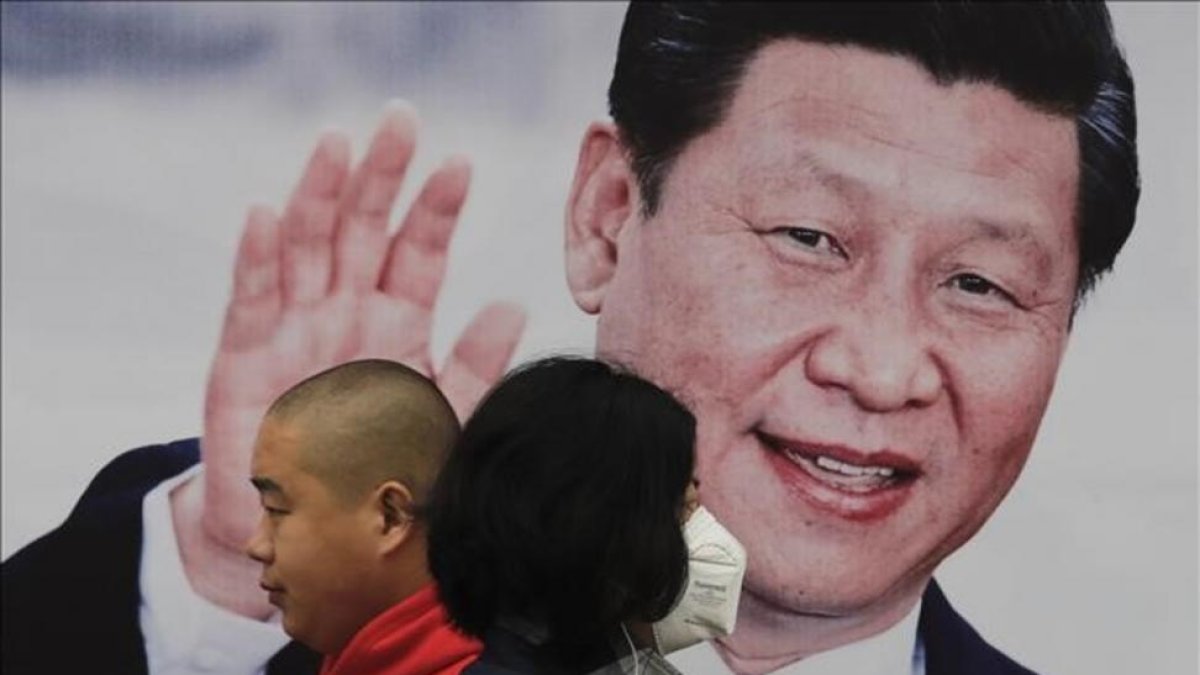 Cartel del presidente chino, Xi Jinping, en una calle de Pekín