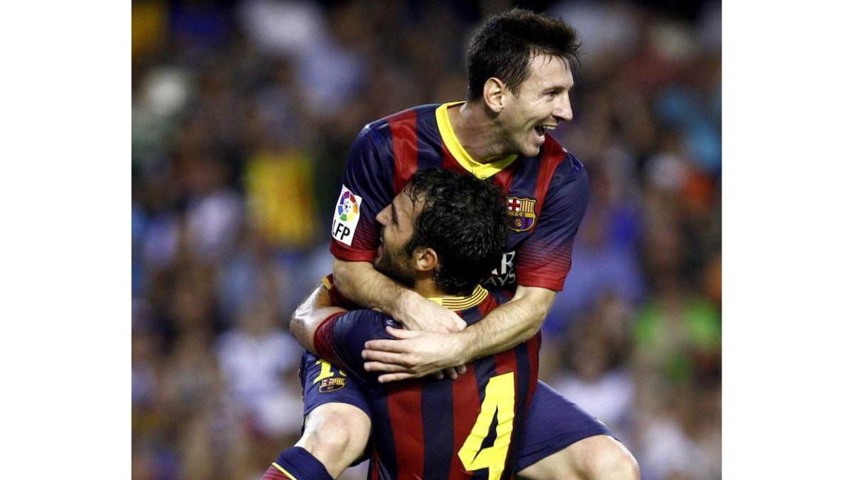 El argentino Leo Messi celebra uno de los tres goles que consiguió ante el Valencia.