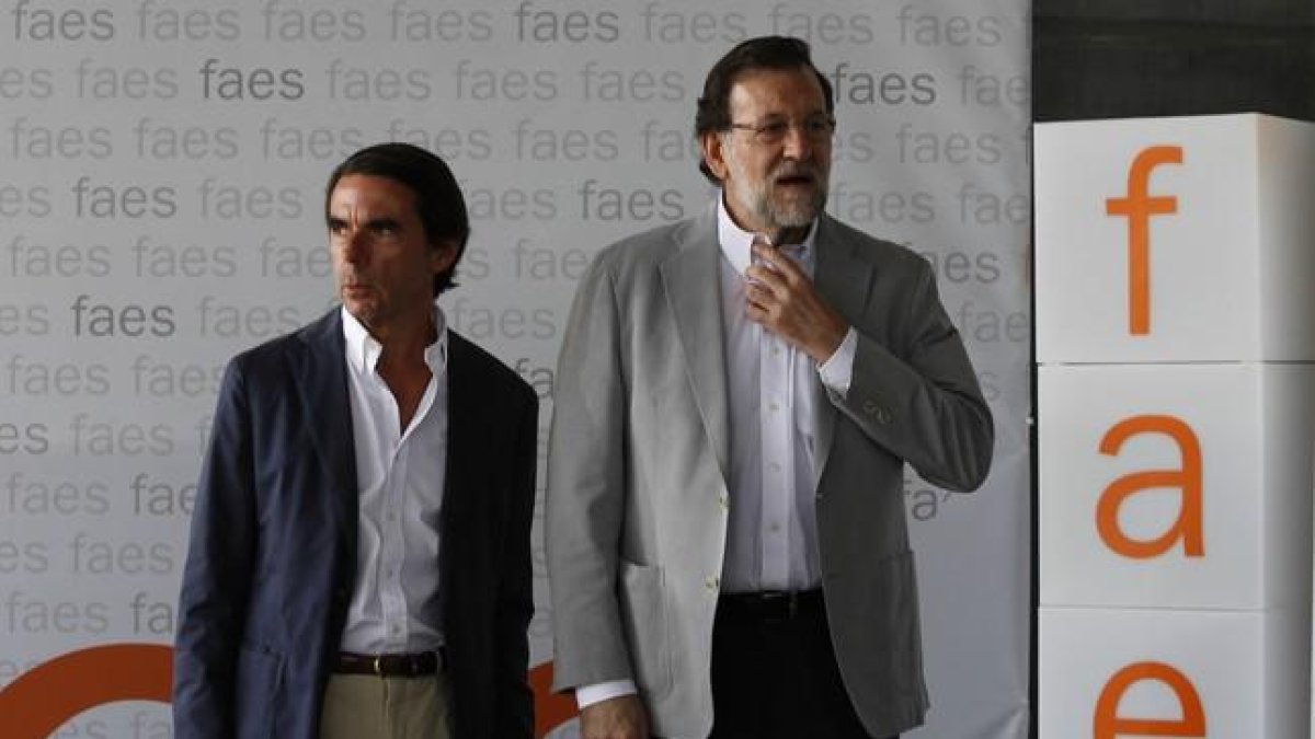 José María Aznar y Mariano Rajoy, en Madrid.