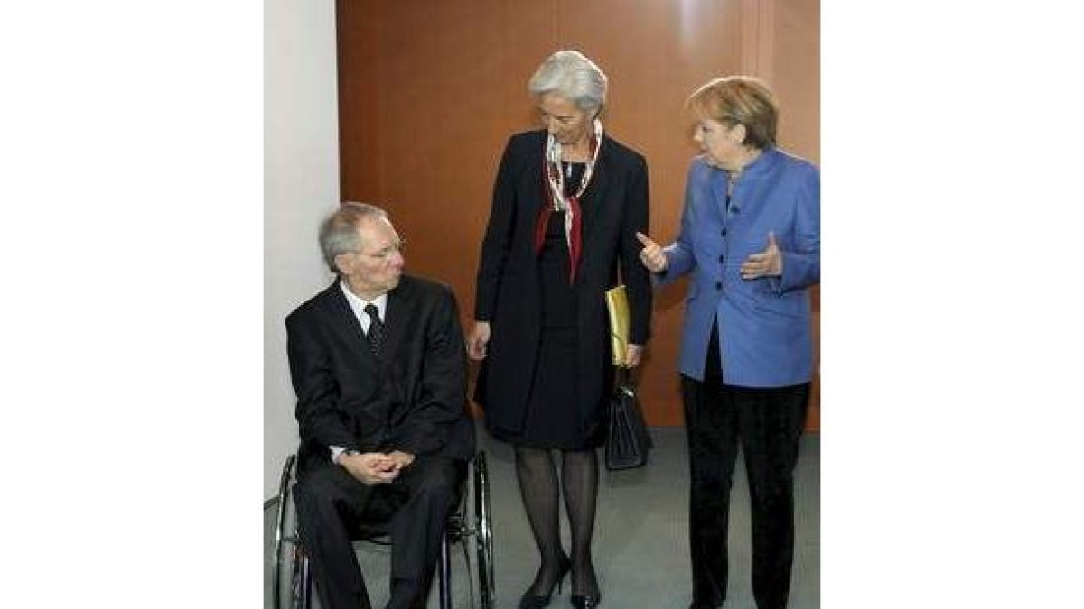 Schäuble, Lagarde y Merkel, antes del Consejo de Ministros.