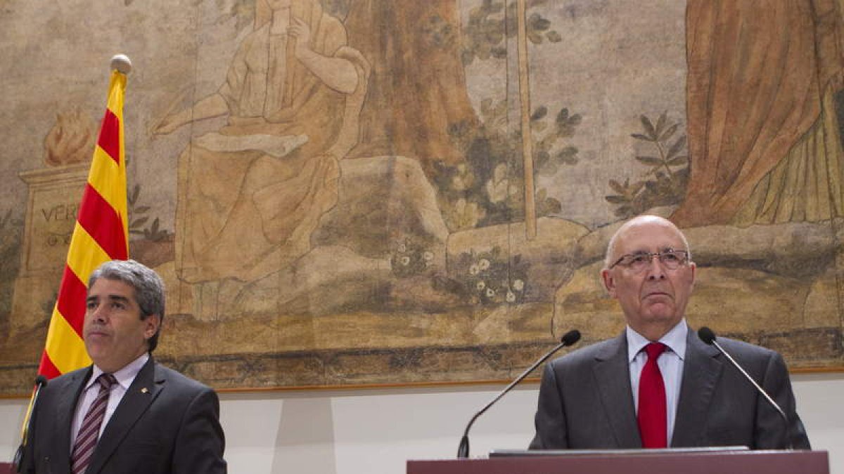 Francesc Homs y el ex presidente del Parlament, Joan Rigol.