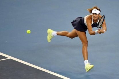 Muguruza, en acción ante Lucic en el torneo de Pekín.