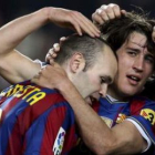 Andrés Iniesta, izquierda, será baja para el encuentro de mañana ante el Arsenal.
