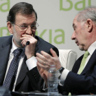 Rajoy y Rato, en el encuentro financiero internacional.
