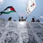 Las calles de Palestina amanecieron ayer literalmente empapeladas con póster de Arafat