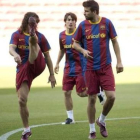 Puyol, Bojan y Piqué, durante el entrenamiento para preparar la final de la Liga de Campeones.