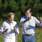 El presidente del Gobierno, Mariano Rajoy, y la canciller alemana, Angela Merkel, ayer.