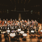 Los integrantes de la Orquesta Sinfónica de León Odón Alonso en el escenario del Auditorio. DL