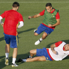 Lucas Vázquez, Sergio Ramos y Morata, de espalda, en el entrenamiento de ayer en Las Rozas. MARISCAL