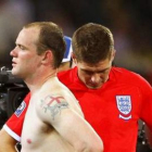 Rooney y Gerrard eran al final del partido la imagen viva de la debacle inglesa.