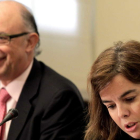 Cristóbal Montoro y Soraya Sáenz de Santamaría, durante la comisión de Gobierno.
