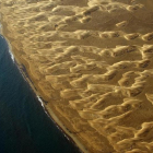 Panorámica área de la Punta del Fangar, en el delta del Ebro, en el año 2009. La zonas deltaicas, que ya aprecian claramente el aumento del nivel del mar, son uno de los territorios más vulnerables al cambio climático.