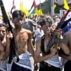 Niños palestinos participan en una manifestación donde piden a Sadam Husein que ataque Israel