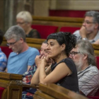 Los diputados de la CUP, en sus escaños del Parlament.