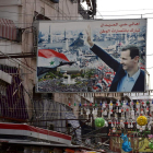 Un cartel alabando el gobierno de Assad en una calle de Damasco. YOUSSEF BADAWI