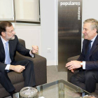 Mariano Rajoy, presidente del Partido Popular y Antonio Tajani, Vicepresidente de la Comisión Europea, durante la reunión que han mantenido hoy en la sede del partido.