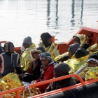 Llegada de un grupo de menores y mujeres inmigrantes al puerto de Melilla tras ser rescatados por Salvamento Maritimo.