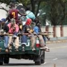 Los soldados de Taylor recorren Monrovia armados y en camioneta tras los últimos ataques rebeldes