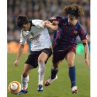 Puyol pugna con Villa durante el último partido