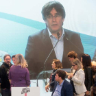 Puigdemont interviene por videoconferencia desde Bruselas la jornada electoral del 26M. MARTA PÉREZ