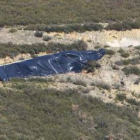 Los técnicos de Fomento han colocado lonas en lo alto de la montaña para evitar filtraciones