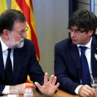 El presidente del Gobierno, Mariano Rajoy, y el presidente de la Generalitat de Catalunya, Carles Puigdemont.