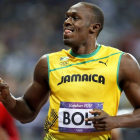 Usain Bolt celebra exultante su triunfo en los 100 metros donde corroboró su supremacía mundial en las pruebas de velocidad.