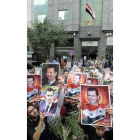 Ciudadanos sirios protestan para apoyar a Bashar Assad.