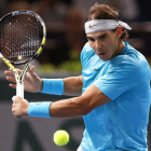 Nadal devuelve una bola en su partido ante Granollers.