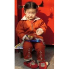 Una niña juega en la ciudad milenaria al norte de Pekín