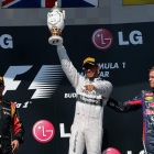 Hamilton flanqueado por Alonso y Raikkonen en el podio.