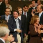 Aznar y su mujer, Ana Botella, a su llegada al Auditorio; detrás Herrera y Lucas