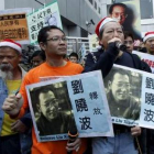 Manifestantes contra el gobierno chino.
