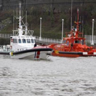 Lanchas de Salvamento Marítimo y de la Ertzaintza en el canal de Deusto en previsión del temporal.