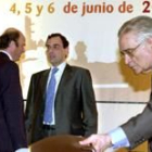 Luis de Guindos, Caruana y Luis Ángel Rojo, ayer en Sevilla