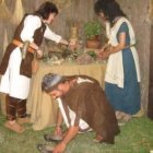 Varios astures decoran su palloza, ubicada en el campamento de El Melgar.