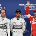 Hamilton, flanqueado por Rosberg (izquierda) y Vettel, tras la calificación de Austria.